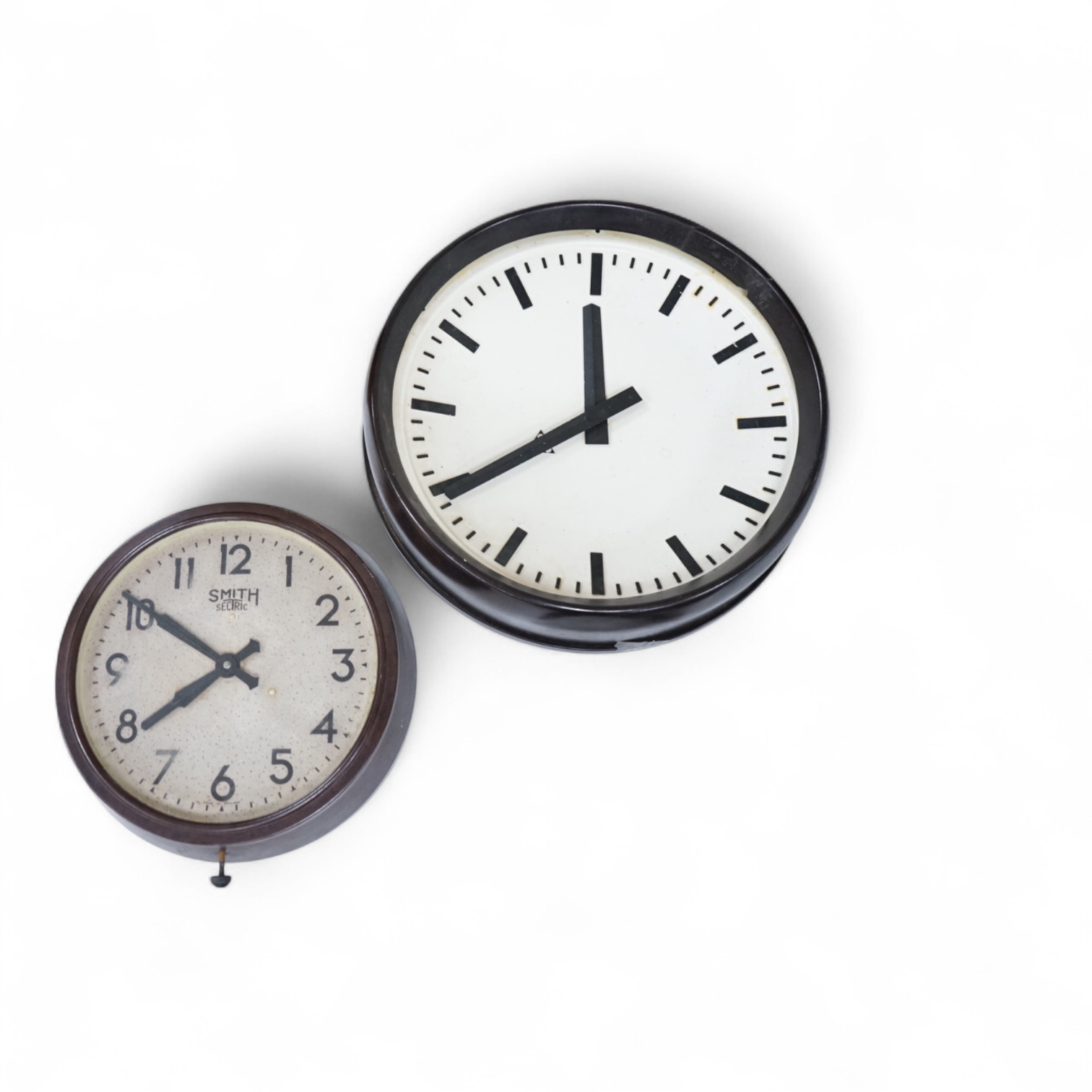 Two 20th century electric wall clocks, including a Smith’s Bakelite example, largest 47cm diameter